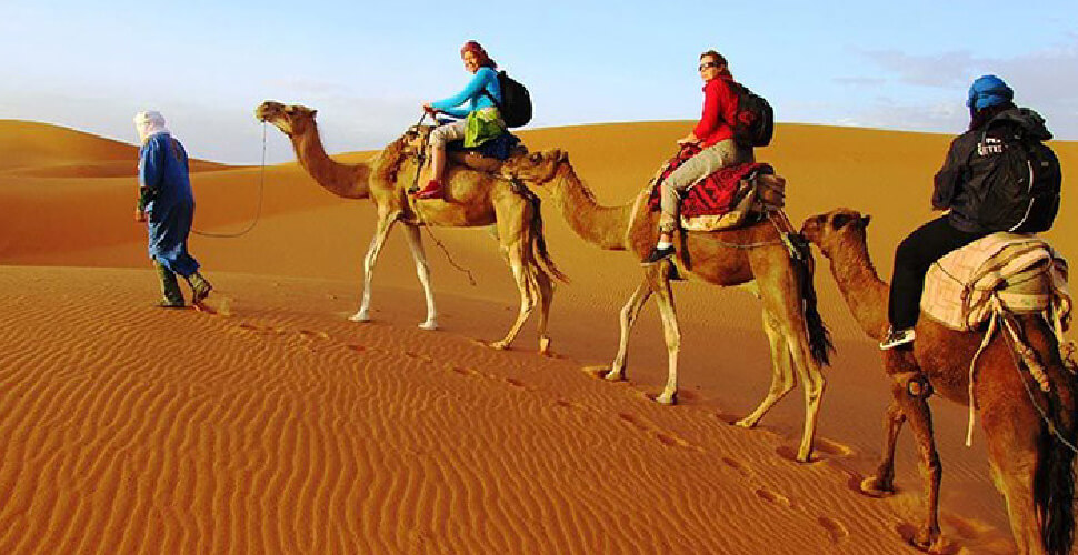 Morocco desert tours — camel trekking on Erg Chebbi sand dunes